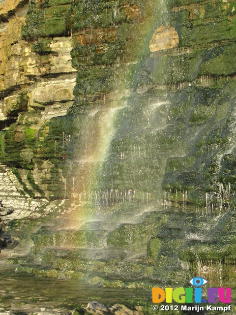 SX25599 Rainbow in waterfall from cliff